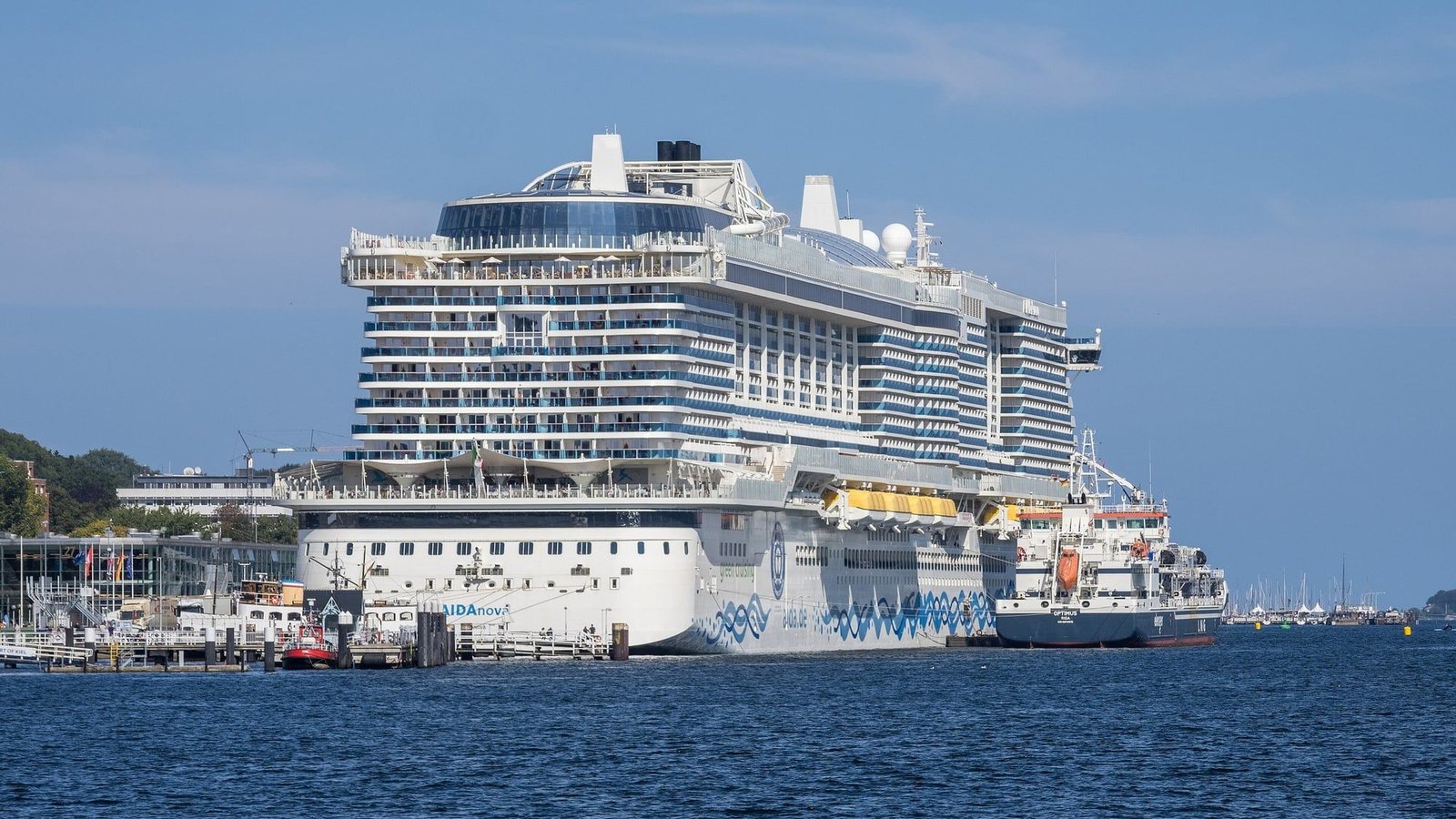 The cruise ship AIDAnova at Kiel's Ostseekai cruise terminal, seen from the water