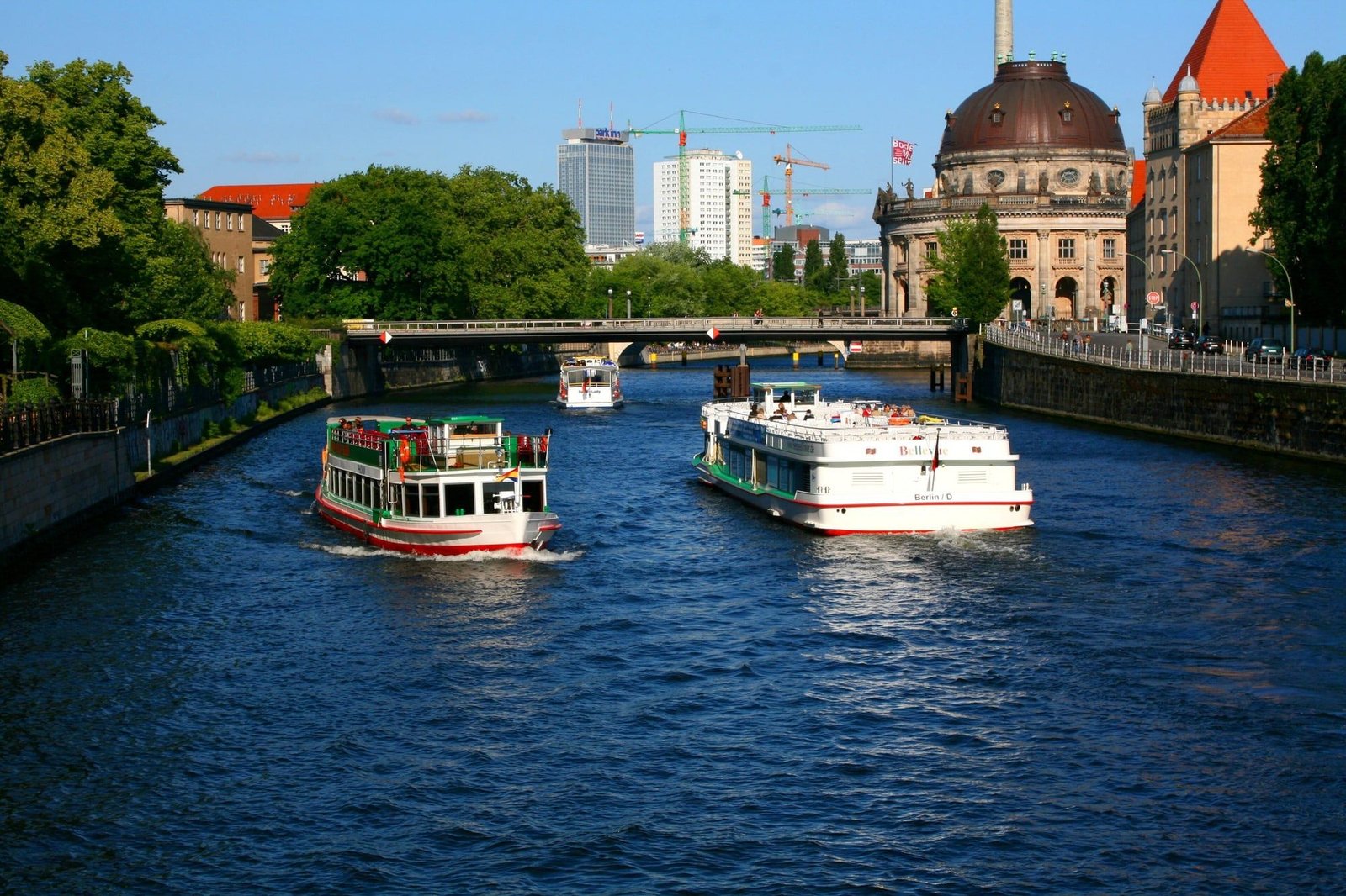 Two sightseeing boats on the Spree near the Bode-Museum on Museum Island